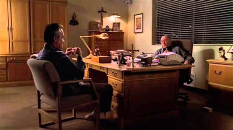 priest from the sopranos|Paulie talks with the priest .